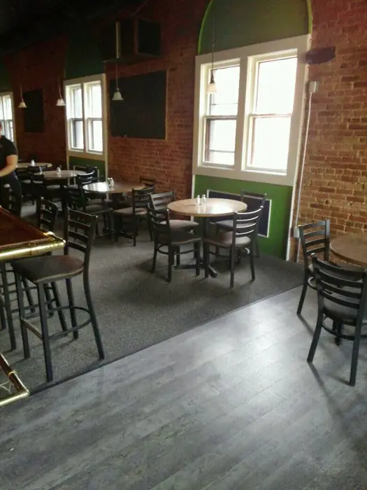 The original Andy's dining room with brick walls and tall windows