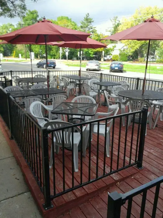 Andy's sidewalk patio on Broad Street with red umbrellas